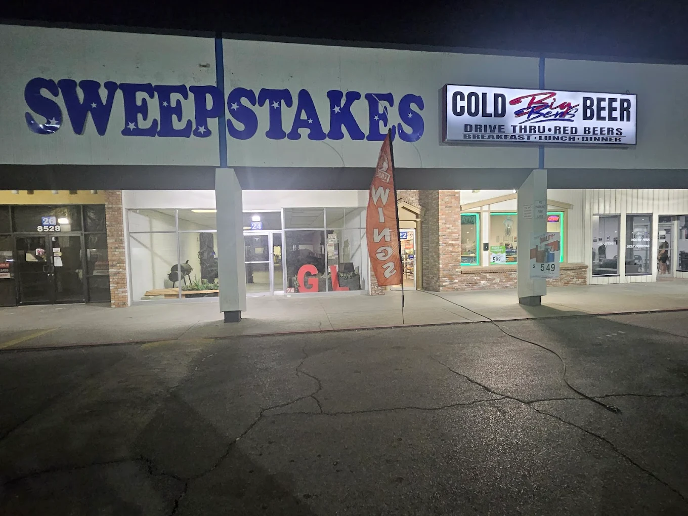Big Ben's Drive Thru storefront at night on Dyer Street